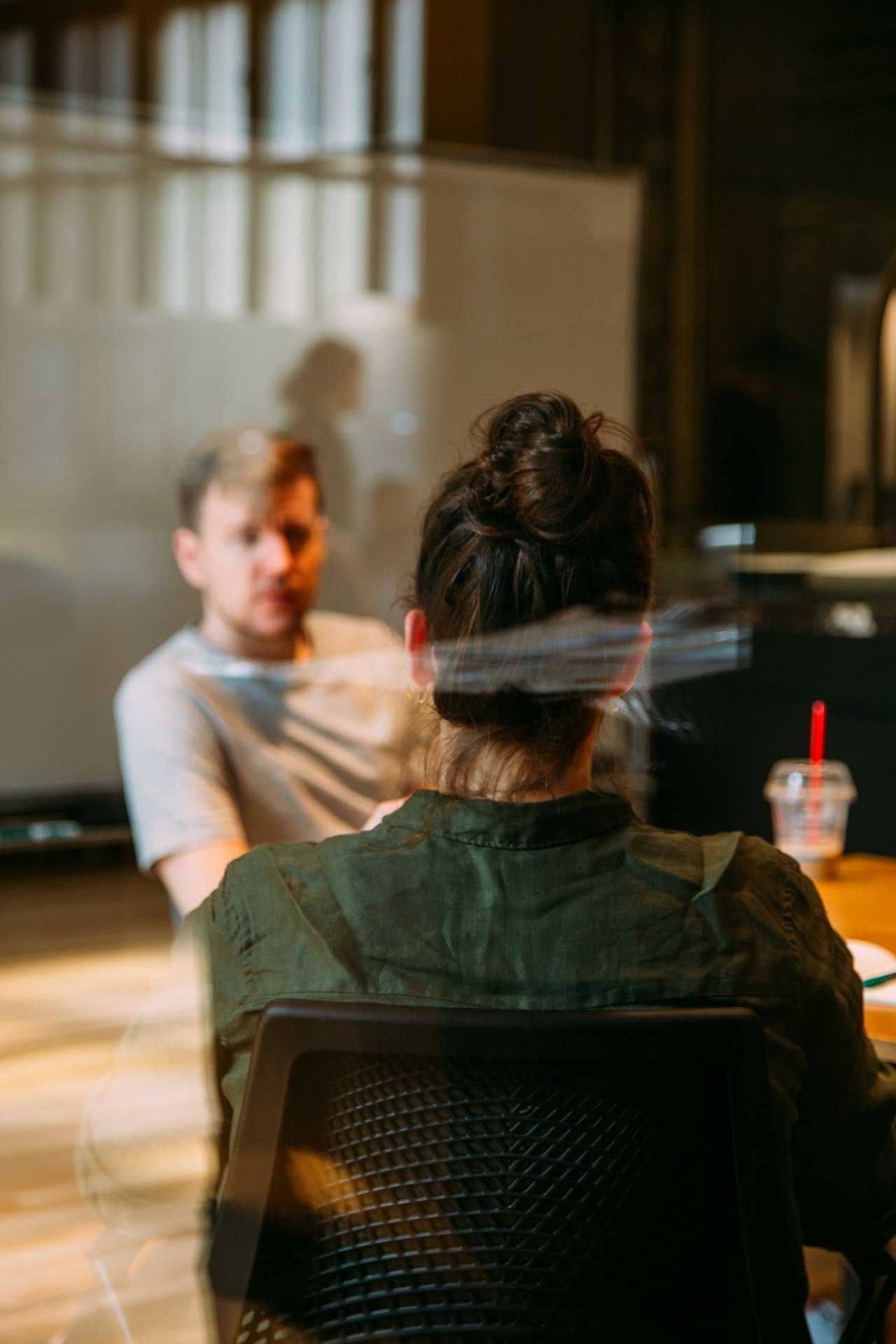 A sales manager coaching a team member