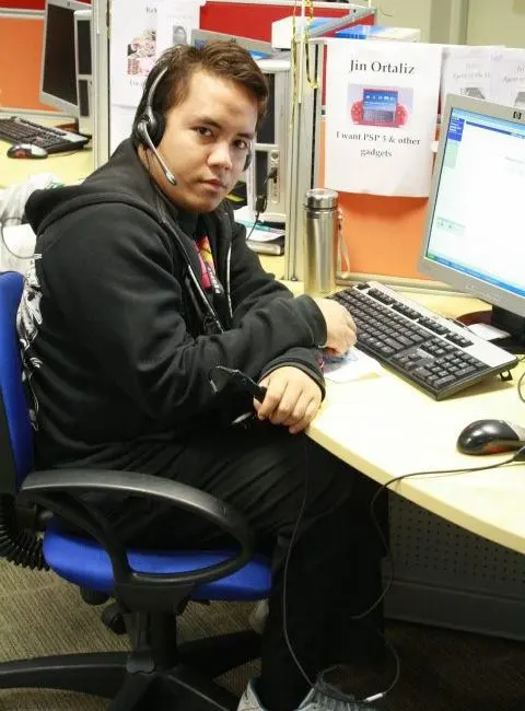 A worker at a desk with a computer