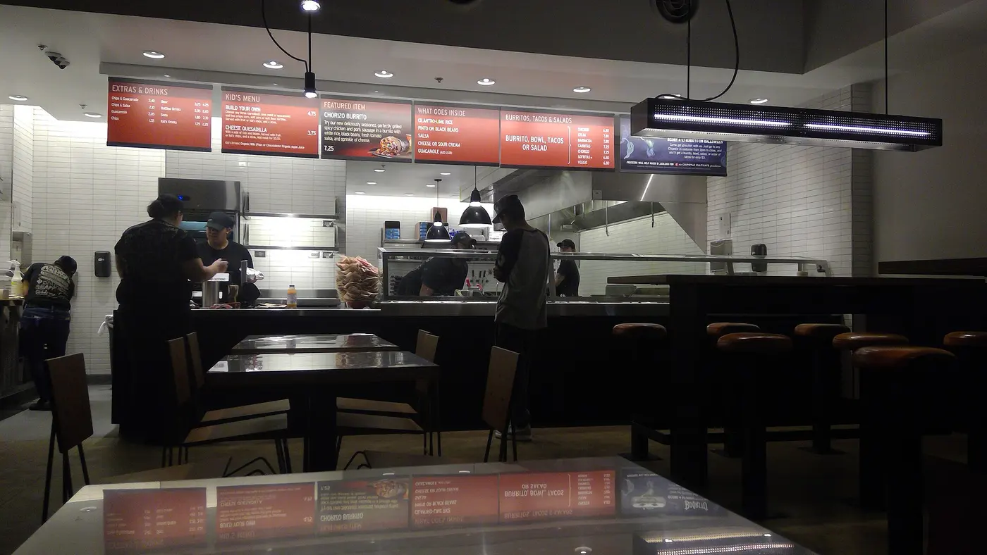 The service counter area of a Chipotle restaurant